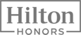 The image shows the Hilton Honors logo in a rectangular frame, with "Hilton" above "Honors" in bold letters.